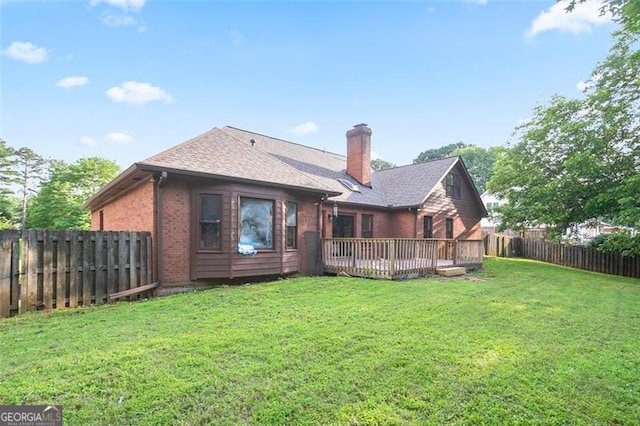 300 Saddle Creek Ln, Roswell, GA 30076 - rear view of house featuring brick siding, a fenced backyard, a chimney, a deck, and roof with shingles