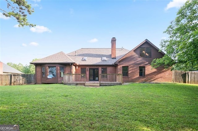 300 Saddle Creek Ln, Roswell, GA 30076 - back of property with a deck, a chimney, a fenced backyard, and brick siding