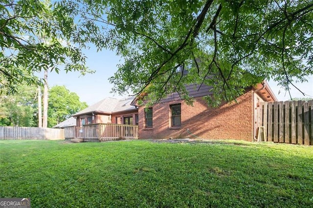 300 Saddle Creek Ln, Roswell, GA 30076 - rear view of property featuring brick siding, a fenced backyard, and a wooden deck