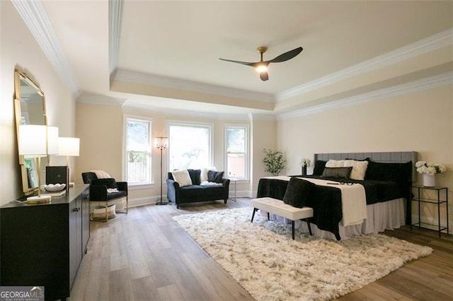 300 Saddle Creek Ln, Roswell, GA 30076 - bedroom with a raised ceiling, light wood-style flooring, crown molding, and a ceiling fan