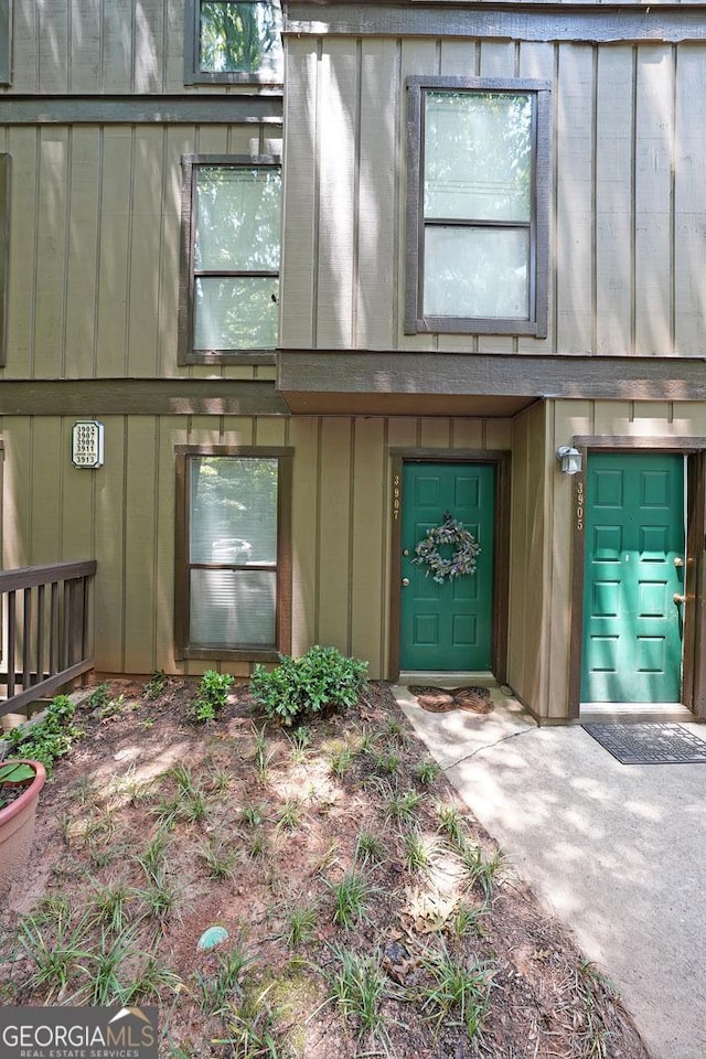 3907 Cedar Cir, Tucker, GA 30084 - doorway to property with board and batten siding
