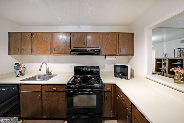 3907 Cedar Cir, Tucker, GA 30084 - kitchen with black appliances, exhaust hood, light countertops, and dark brown cabinetry
