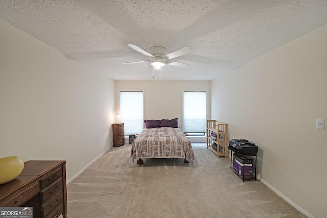 3907 Cedar Cir, Tucker, GA 30084 - carpeted bedroom with a textured ceiling and ceiling fan