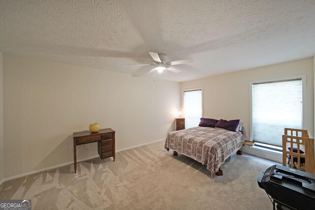 3907 Cedar Cir, Tucker, GA 30084 - carpeted bedroom with a textured ceiling and a ceiling fan