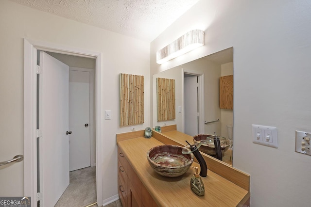 3907 Cedar Cir, Tucker, GA 30084 - bathroom featuring vanity and a textured ceiling