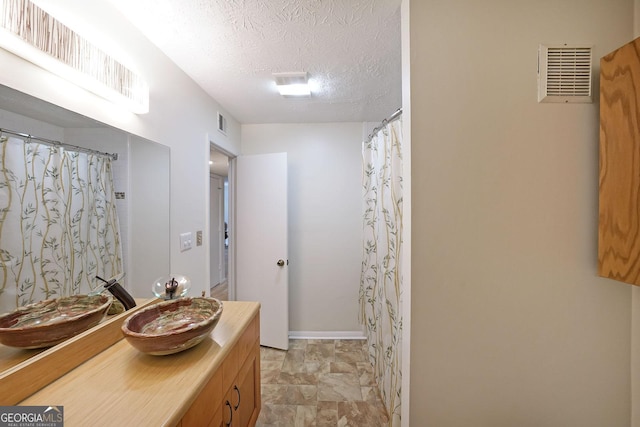 3907 Cedar Cir, Tucker, GA 30084 - bathroom featuring vanity, a textured ceiling, and a shower with shower curtain