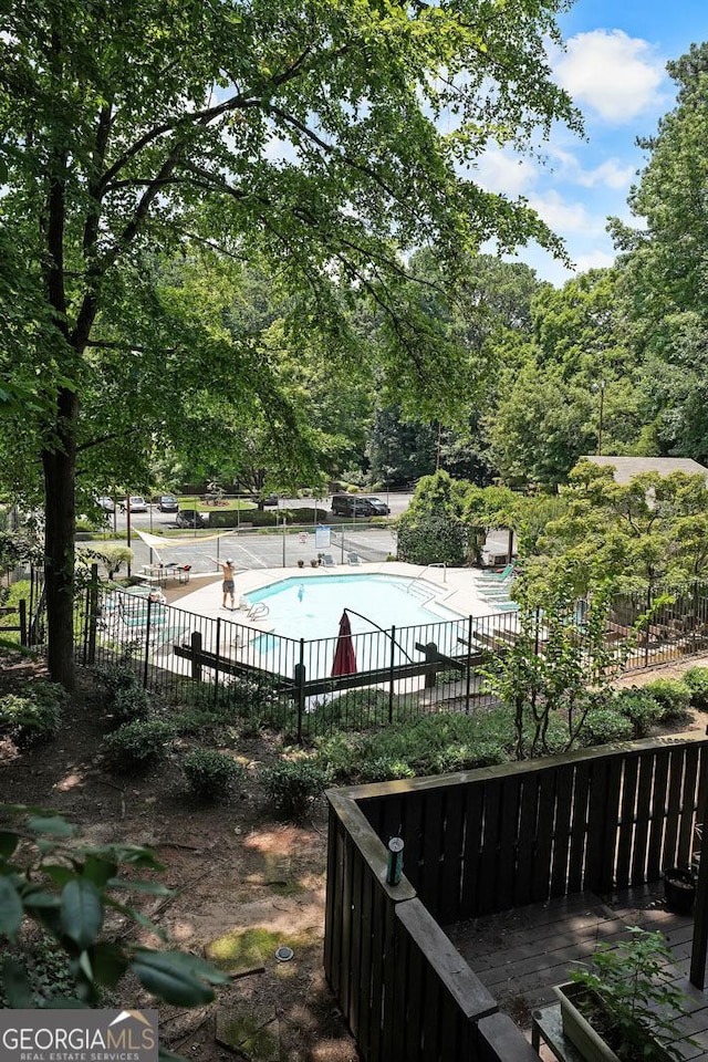 3907 Cedar Cir, Tucker, GA 30084 - wooden deck with a community pool and a patio
