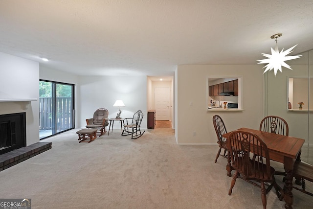 3907 Cedar Cir, Tucker, GA 30084 - dining space featuring light colored carpet and a brick fireplace