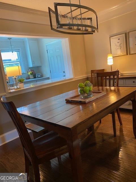 201 William D Evans Ct, Kathleen, GA 31047 - dining area featuring a chandelier, crown molding, and wood finished floors