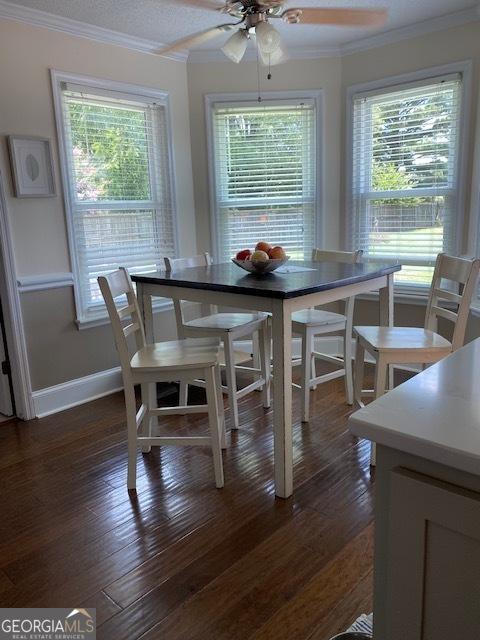 201 William D Evans Ct, Kathleen, GA 31047 - dining space with ornamental molding, plenty of natural light, a ceiling fan, and dark wood-style flooring