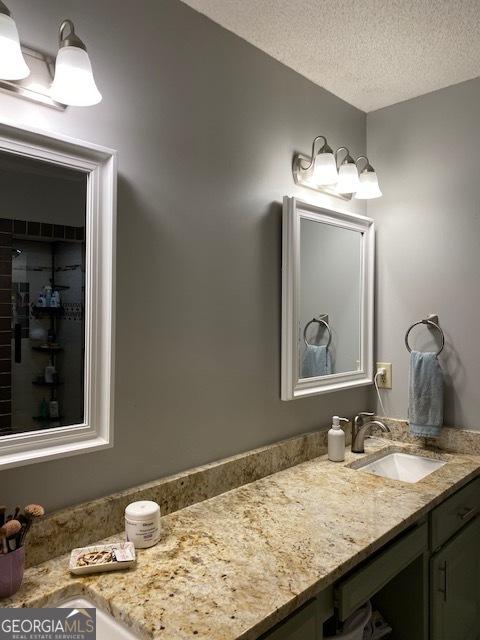 201 William D Evans Ct, Kathleen, GA 31047 - bathroom with vanity and a textured ceiling