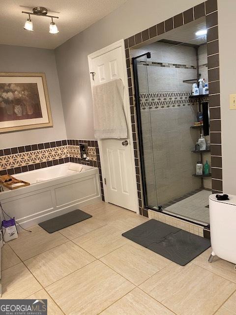 201 William D Evans Ct, Kathleen, GA 31047 - full bath featuring tile patterned floors, a stall shower, and a bath