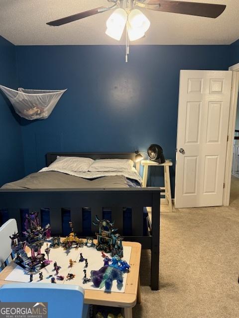 201 William D Evans Ct, Kathleen, GA 31047 - bedroom with carpet floors and ceiling fan