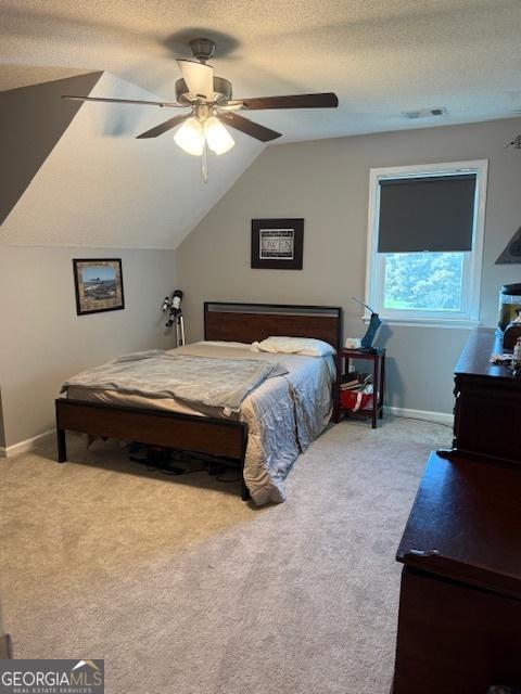 201 William D Evans Ct, Kathleen, GA 31047 - bedroom with carpet, lofted ceiling, a textured ceiling, and ceiling fan
