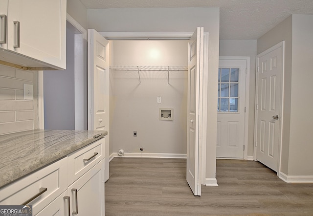85 Holly Springs Rd, Sharpsburg, GA 30277 - laundry area featuring washer hookup, hookup for an electric dryer, and light wood-style floors