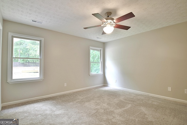 85 Holly Springs Rd, Sharpsburg, GA 30277 - empty room featuring ceiling fan, carpet flooring, and a textured ceiling