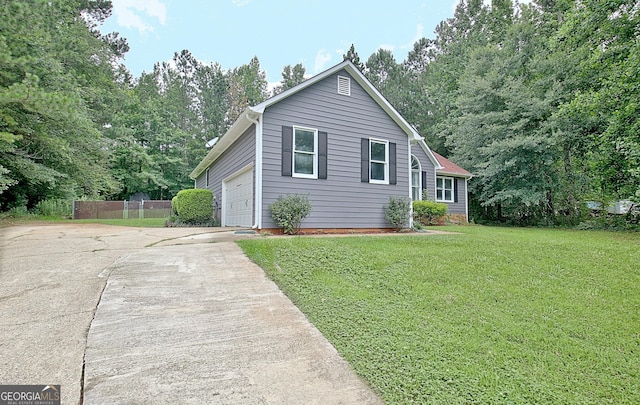 85 Holly Springs Rd, Sharpsburg, GA 30277 - view of front facade with driveway and a garage