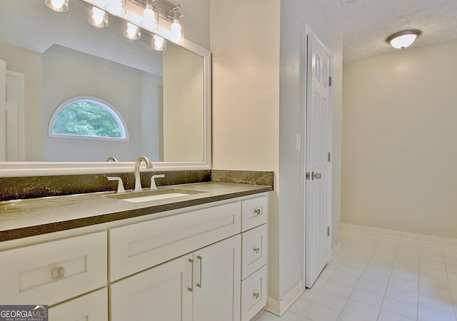 85 Holly Springs Rd, Sharpsburg, GA 30277 - bathroom featuring vanity, tile patterned flooring, and a textured ceiling