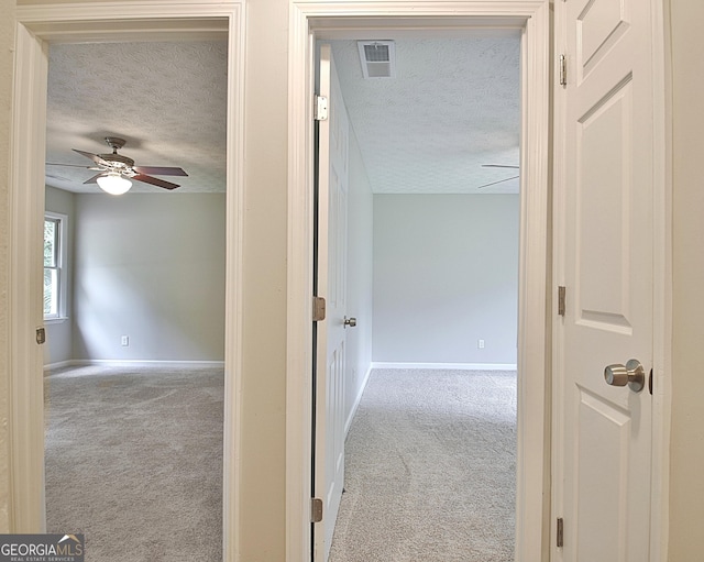 85 Holly Springs Rd, Sharpsburg, GA 30277 - hallway with a textured ceiling and carpet