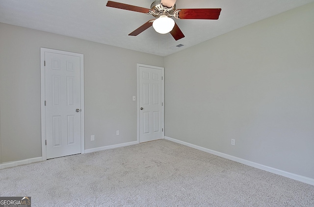 85 Holly Springs Rd, Sharpsburg, GA 30277 - unfurnished bedroom with carpet floors and ceiling fan