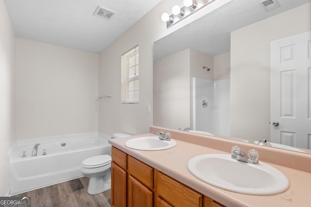 120 Bramble Bush Trl, Covington, GA 30014 - bathroom featuring a bath, double vanity, wood finished floors, and a shower
