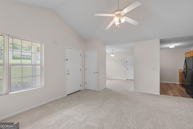 120 Bramble Bush Trl, Covington, GA 30014 - unfurnished living room featuring carpet, a ceiling fan, and lofted ceiling