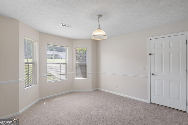 120 Bramble Bush Trl, Covington, GA 30014 - carpeted spare room with baseboards and a textured ceiling