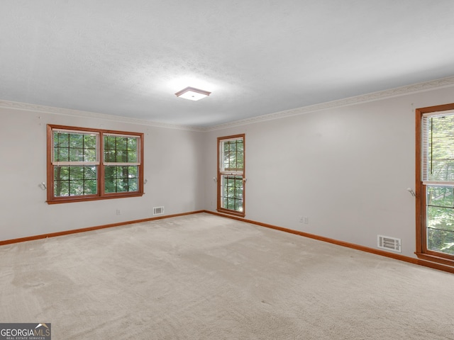 25 Ridgeview Dr, Jonesboro, GA 30236 - carpeted empty room with ornamental molding and a textured ceiling