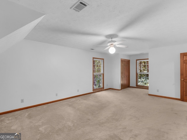 25 Ridgeview Dr, Jonesboro, GA 30236 - unfurnished room with plenty of natural light, light carpet, and ceiling fan