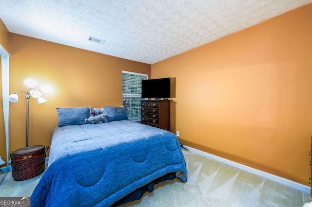 455 Lakeside Cir, Covington, GA 30016 - carpeted bedroom featuring baseboards and a textured ceiling