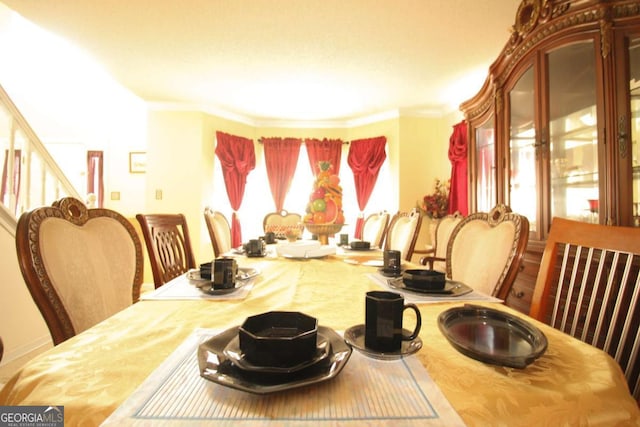 1455 Duren Farms Dr, Lithonia, GA 30058 - dining room with plenty of natural light, crown molding, and stairway