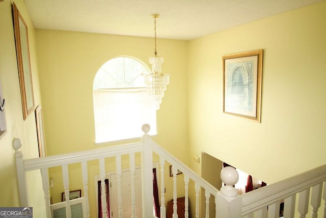 1455 Duren Farms Dr, Lithonia, GA 30058 - staircase with healthy amount of natural light and a chandelier