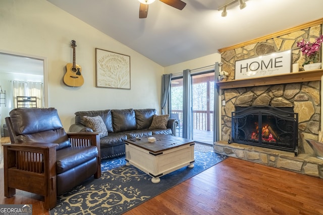 444 Miners Mountain Rd, Sautee Nacoochee, GA 30571 - living room with a ceiling fan, vaulted ceiling, wood finished floors, and a stone fireplace