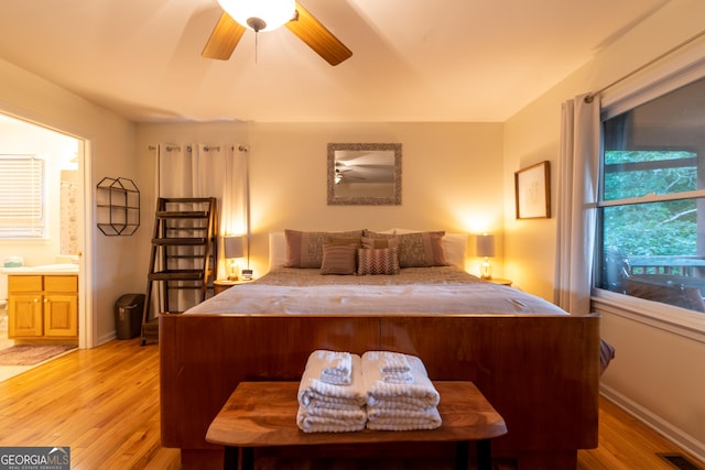 444 Miners Mountain Rd, Sautee Nacoochee, GA 30571 - bedroom featuring light wood-style floors, ensuite bathroom, and ceiling fan
