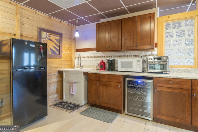 444 Miners Mountain Rd, Sautee Nacoochee, GA 30571 - kitchen featuring freestanding refrigerator, beverage cooler, white microwave, a paneled ceiling, and backsplash