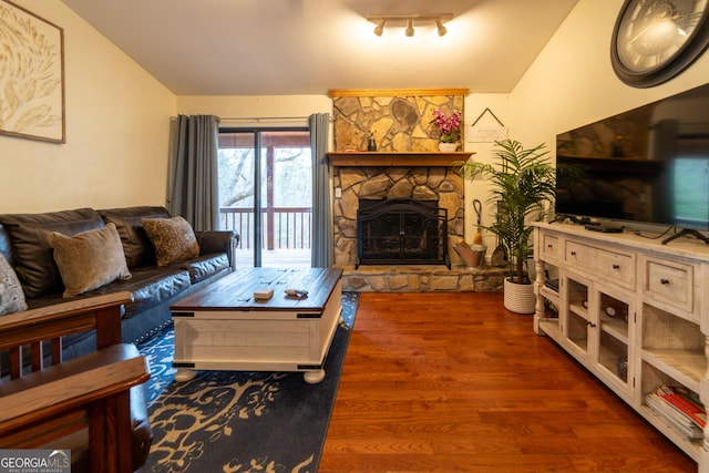 444 Miners Mountain Rd, Sautee Nacoochee, GA 30571 - living area featuring a stone fireplace, vaulted ceiling, and wood finished floors