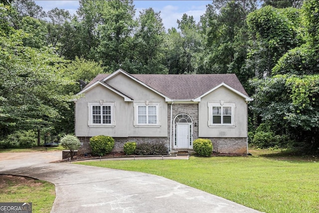 3514 Blackberry, Conyers, GA 30094 - bi-level home featuring a front yard, concrete driveway, stucco siding, and roof with shingles