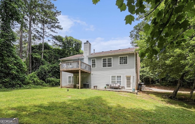 3514 Blackberry, Conyers, GA 30094 - back of property with a lawn, a chimney, and a wooden deck