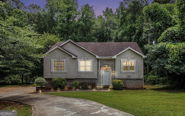 3514 Blackberry, Conyers, GA 30094 - bi-level home with a front yard, stucco siding, concrete driveway, and a shingled roof