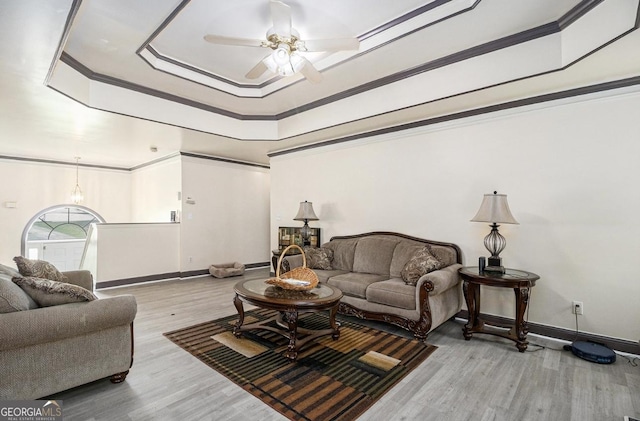 3514 Blackberry, Conyers, GA 30094 - living area featuring wood finished floors, a ceiling fan, a raised ceiling, and crown molding