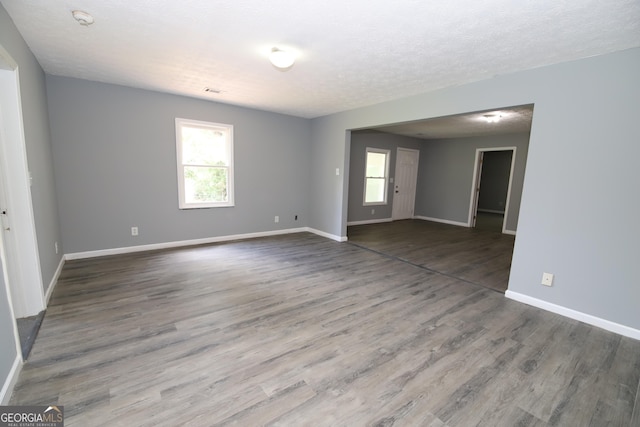 92 Priscilla Dr, Lagrange, GA 30241 - spare room with plenty of natural light, wood finished floors, and a smoke detector