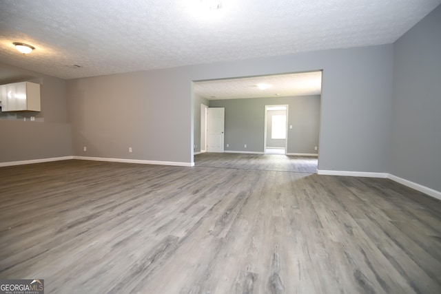 92 Priscilla Dr, Lagrange, GA 30241 - empty room with a textured ceiling and wood finished floors