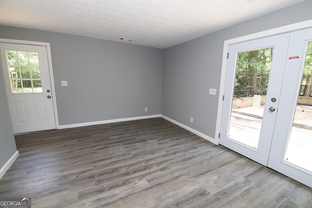 92 Priscilla Dr, Lagrange, GA 30241 - doorway with wood finished floors, a textured ceiling, and french doors