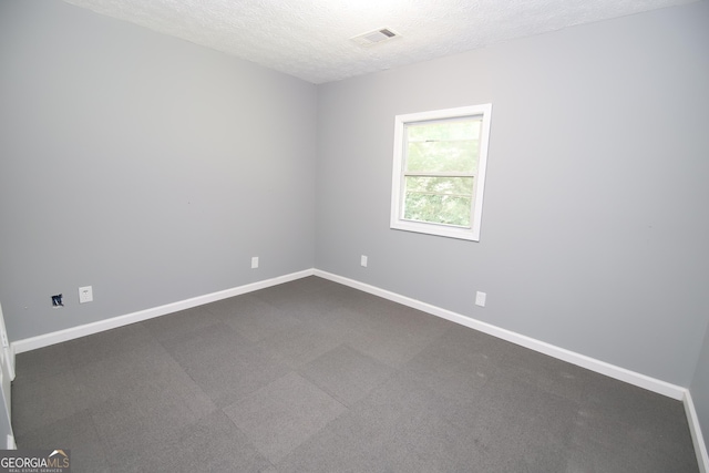 92 Priscilla Dr, Lagrange, GA 30241 - unfurnished room featuring a textured ceiling and dark colored carpet