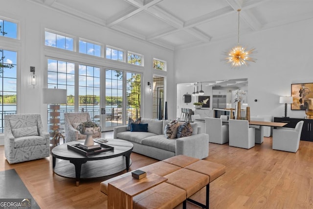 1230 Lake Club Dr, Greensboro, GA 30642 - living area featuring a high ceiling, a chandelier, healthy amount of natural light, light wood-style flooring, and coffered ceiling