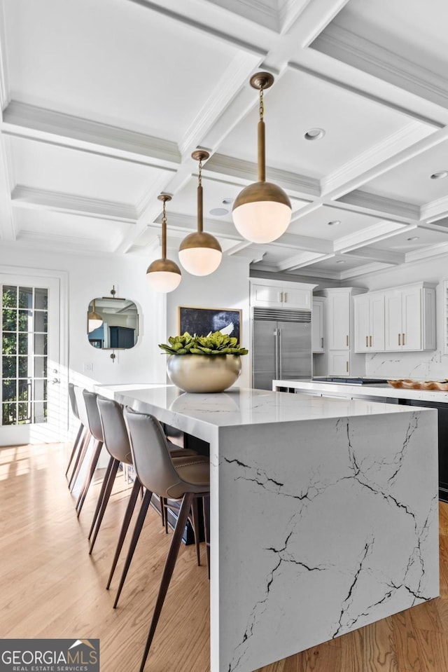 1230 Lake Club Dr, Greensboro, GA 30642 - kitchen with stainless steel built in fridge, coffered ceiling, light wood finished floors, a large island, and white cabinets