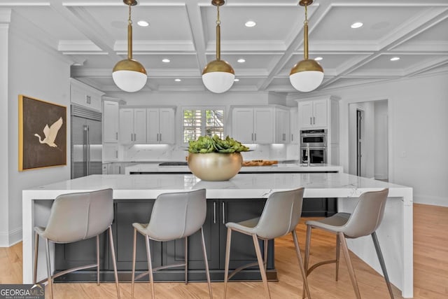 1230 Lake Club Dr, Greensboro, GA 30642 - kitchen featuring stainless steel appliances, a large island, white cabinets, recessed lighting, and light wood-type flooring