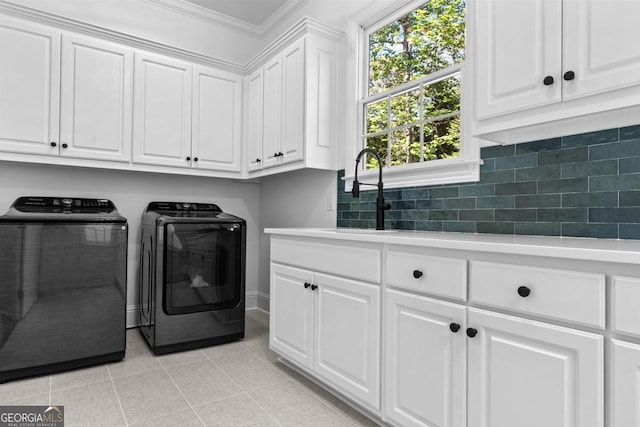 1230 Lake Club Dr, Greensboro, GA 30642 - laundry area with washer and clothes dryer, cabinet space, and crown molding