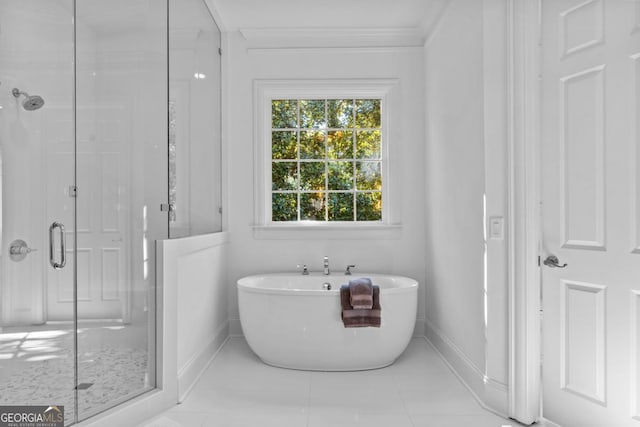 1230 Lake Club Dr, Greensboro, GA 30642 - bathroom with a shower stall, a soaking tub, crown molding, and tile patterned flooring