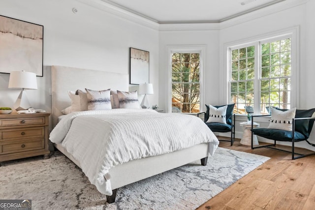 1230 Lake Club Dr, Greensboro, GA 30642 - bedroom with wood finished floors and crown molding